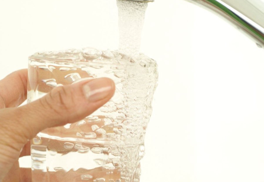 Clear tap water filling a glass in a Fort Wayne kitchen